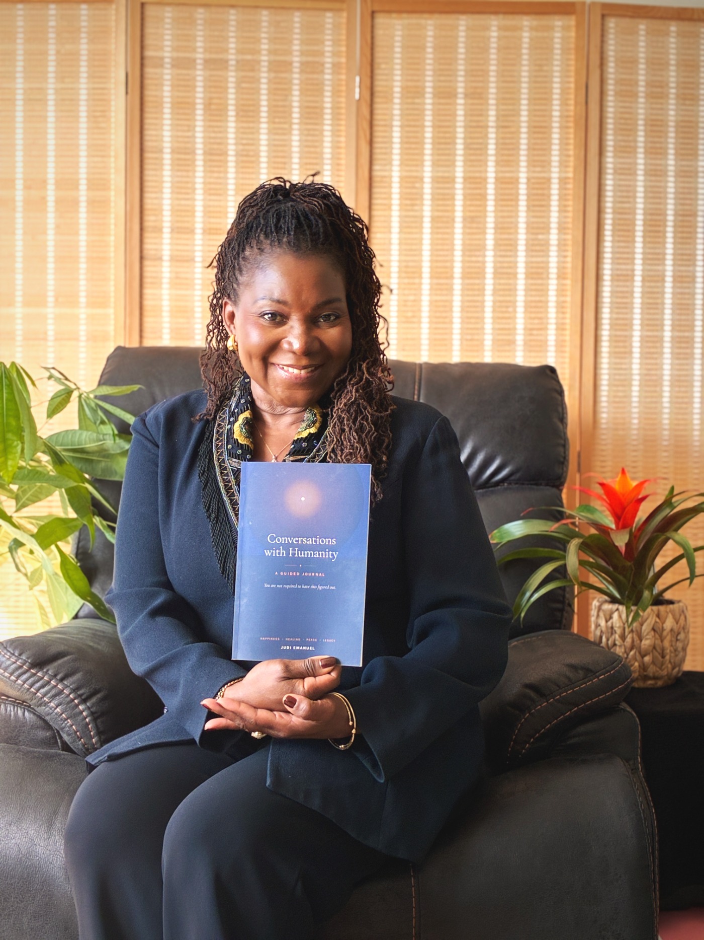 Judi Emanuel holding the journal